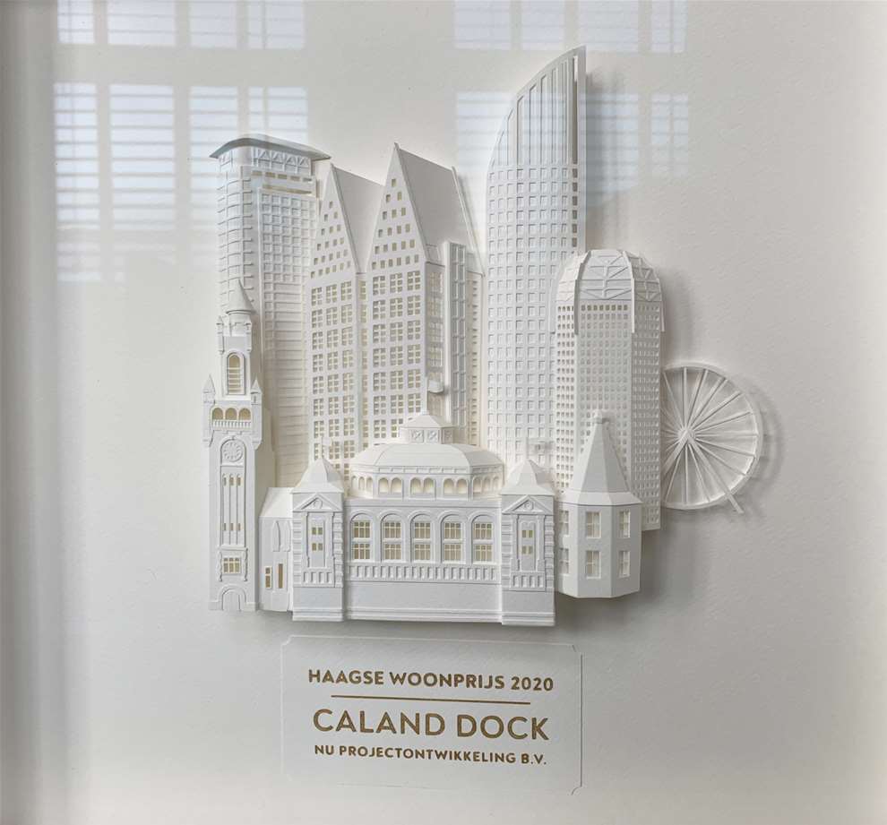 Vera Van Wolferen, Crafted intricate paper sculpture of a magical city. 